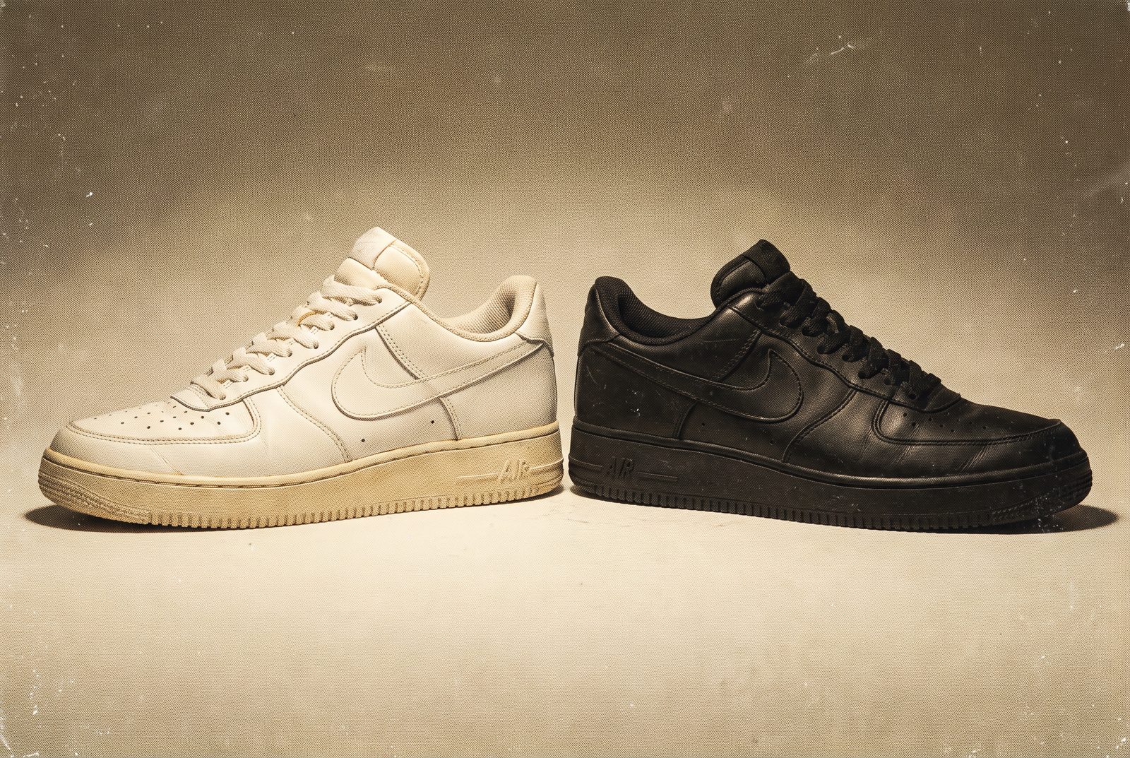 A white pair and a black pair of Air Force 1s side by side
